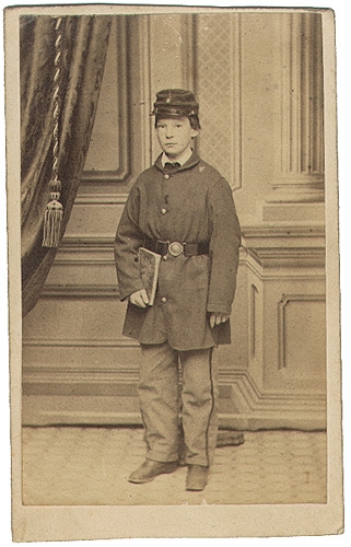 CDV OF A YOUNG BOY IN UNIFORM, WITH A BOSTON BACKMARK