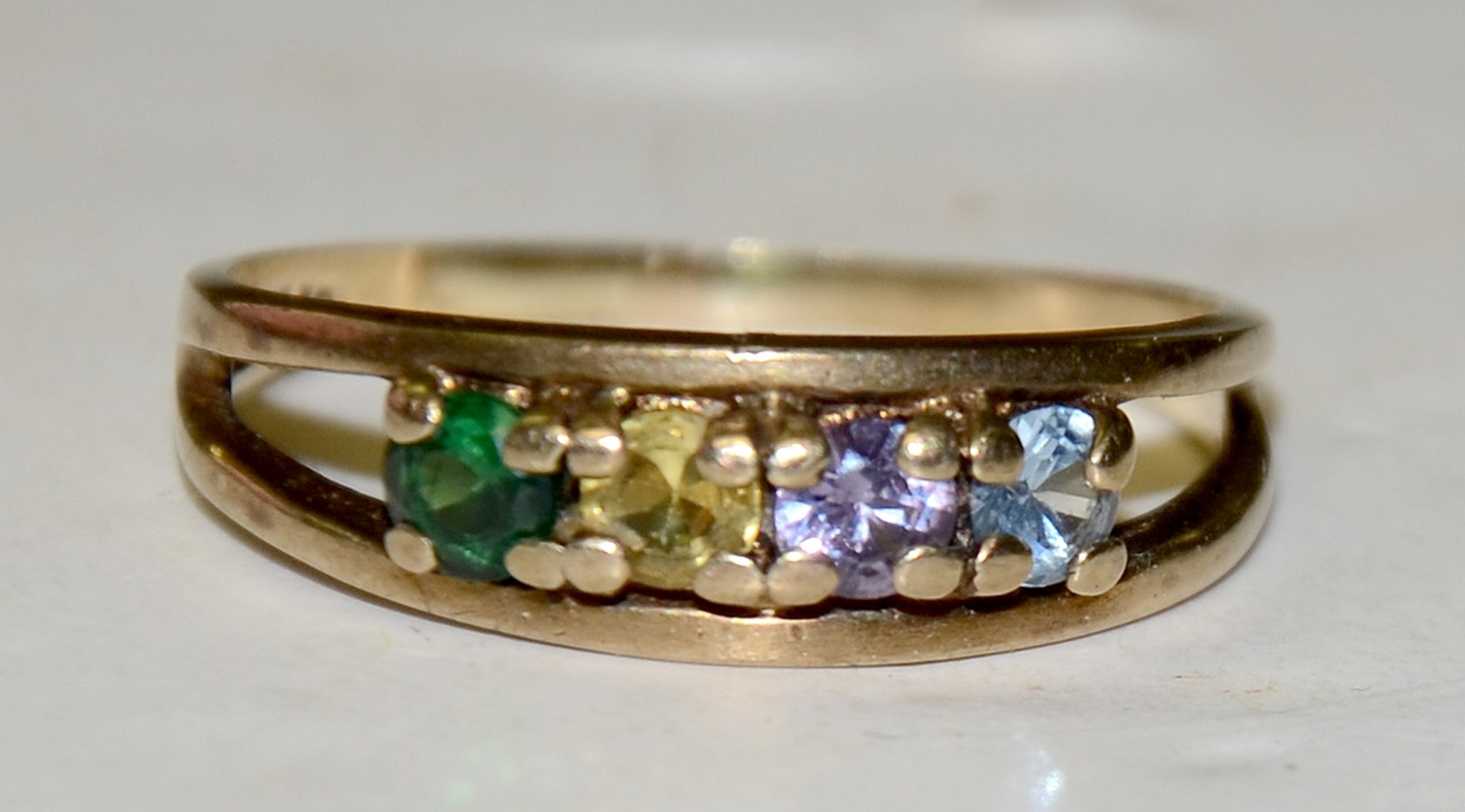 GOLD RING WITH FOUR COLORED STONES