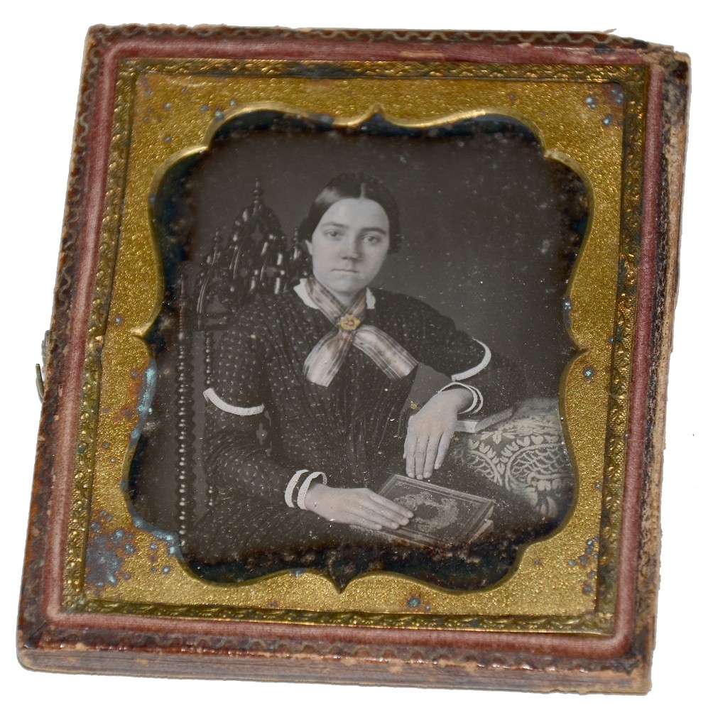 SIXTH PLATE DAGUERREOTYPE OF YOUNG LADY WITH BOOK