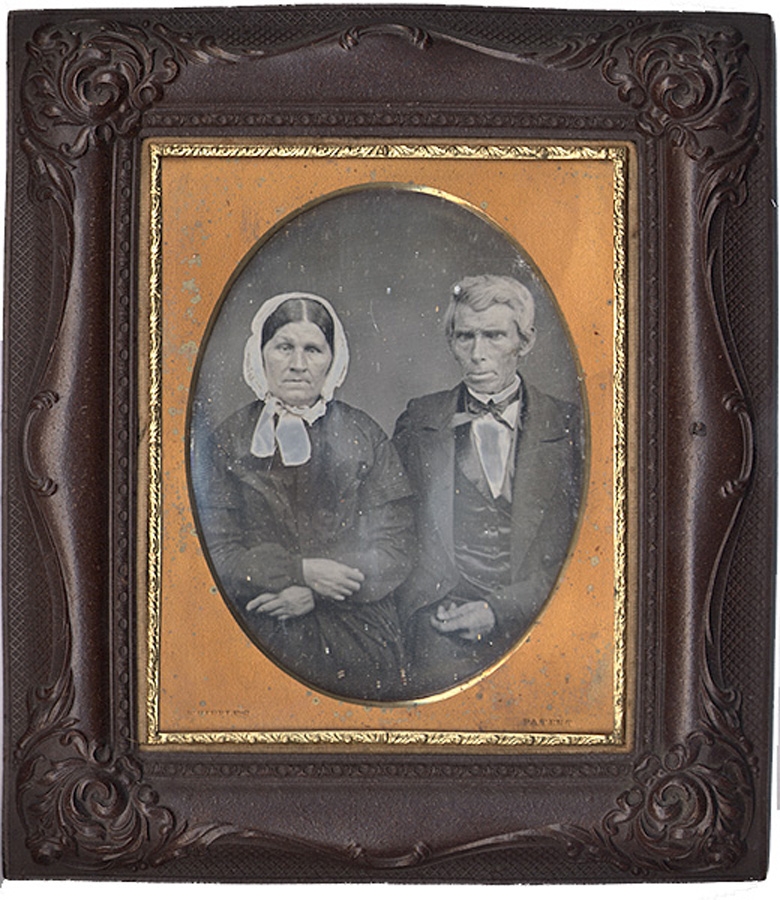 1/2 PLATE DAGUERREOTYPE OF AN OLDER COUPLE, IN A GUTTA PERCHA FRAME