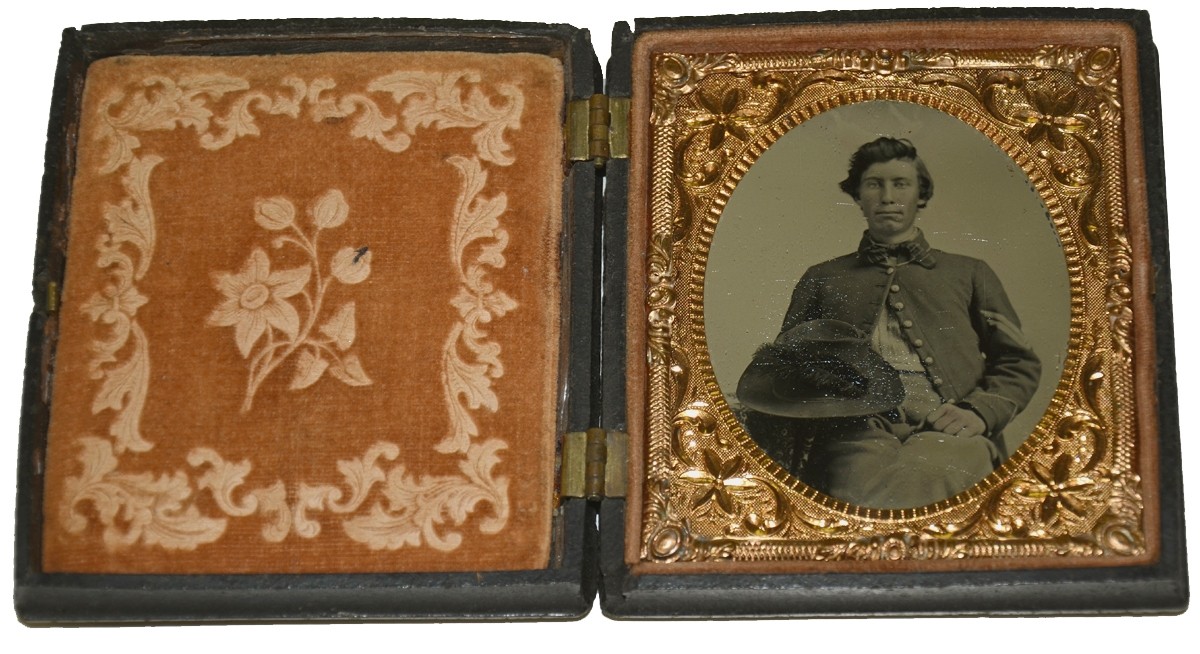 VERY CLEAR SIXTH PLATE TINTYPE OF AN INFANTRY CORPORAL WITH A WELL USED DRESS HAT