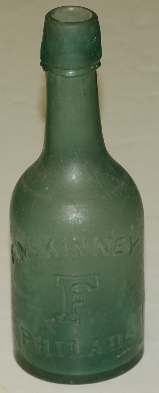 F. McKINNEY SODA BOTTLE
