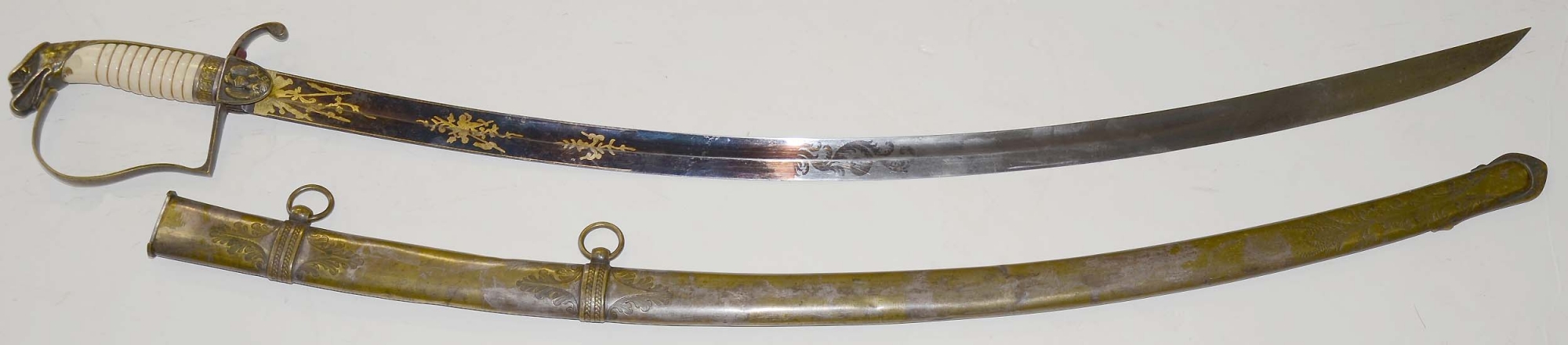 AMERICAN INFANTRY OFFICER’S SWORD CIRCA 1820 WITH EAGLE POMMEL, U.S. EAGLE LANGETS, AND SUPERB BLUE AND GILT BLADE