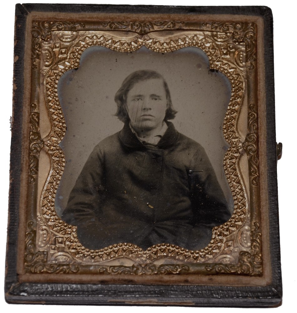SIXTH PLATE AMBROTYPE OF BOY IN A HEAVY COAT