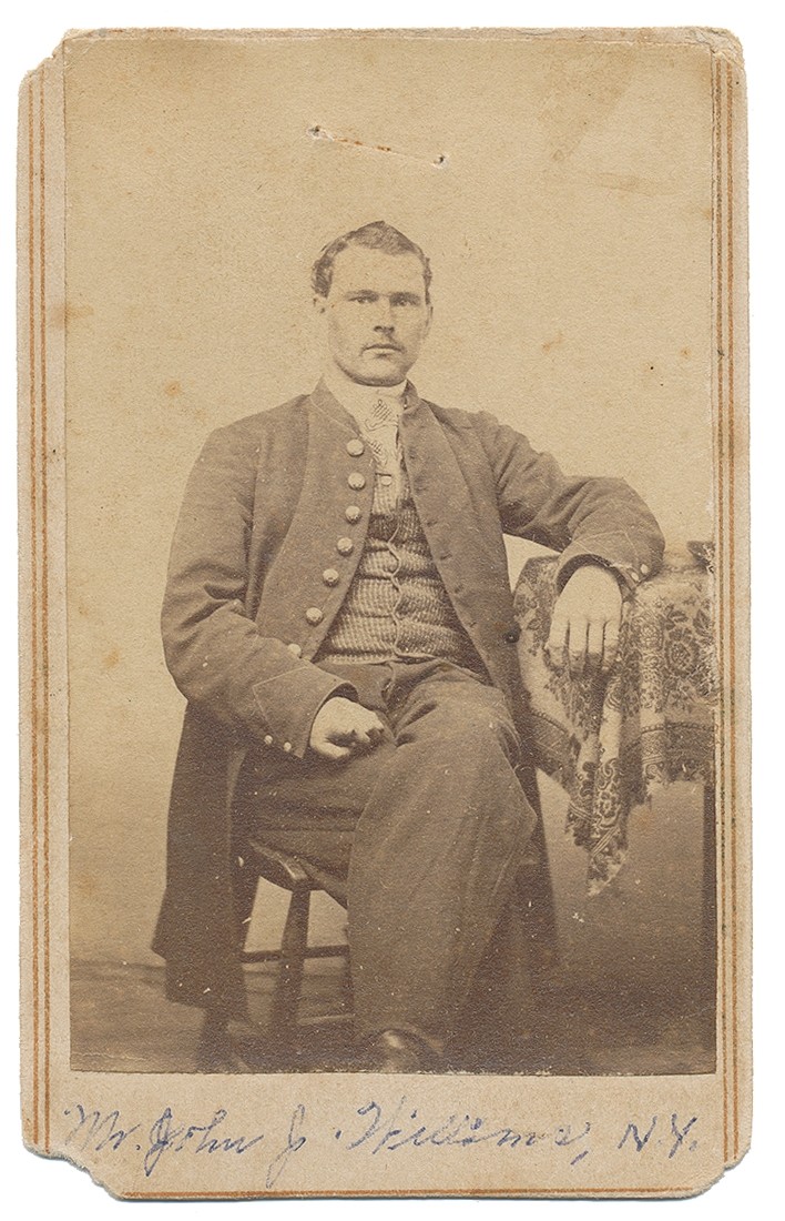 THREE-QUARTER SEATED VIEW OF IDENTIFIED NEW YORK SOLDIER