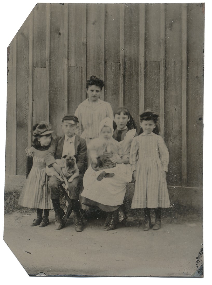 TINTYPE OF A GROUP OF CHILDREN AND THEIR PETS