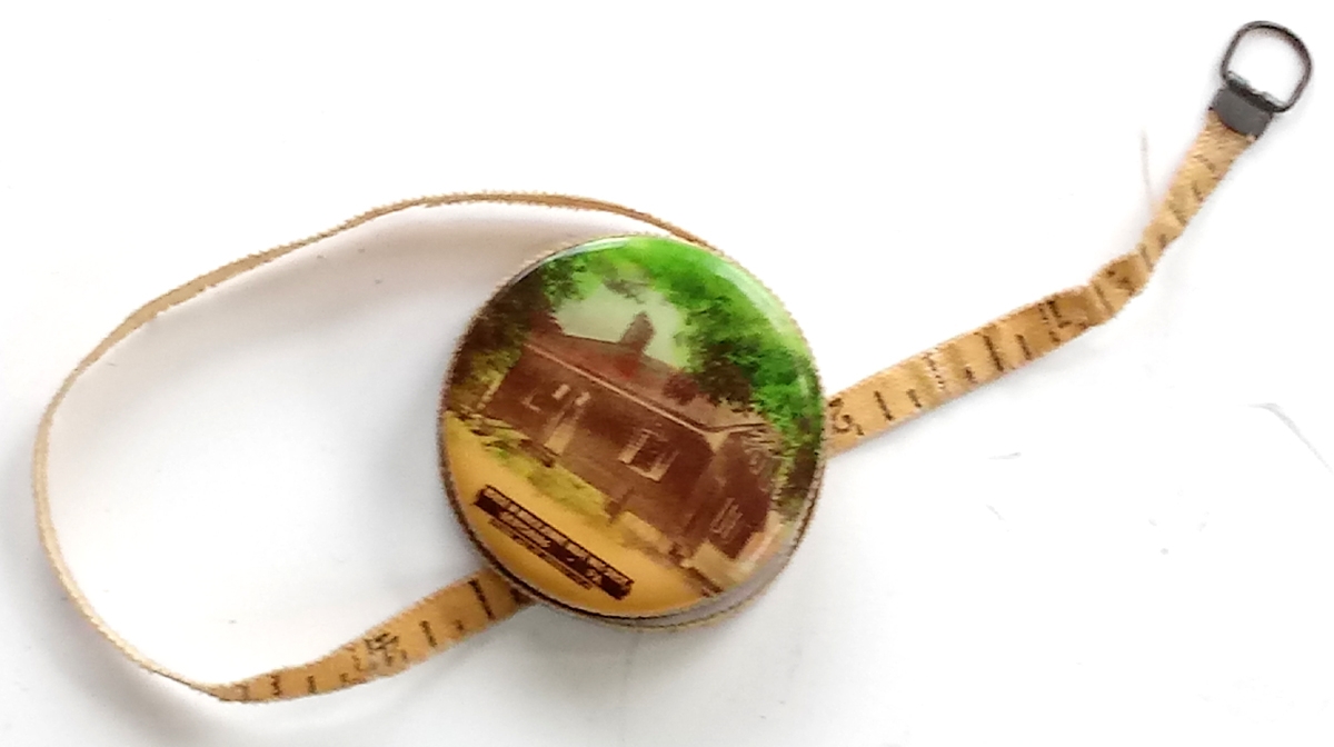 JENNIE WADE HOUSE SOUVENIR TAPE MEASURE