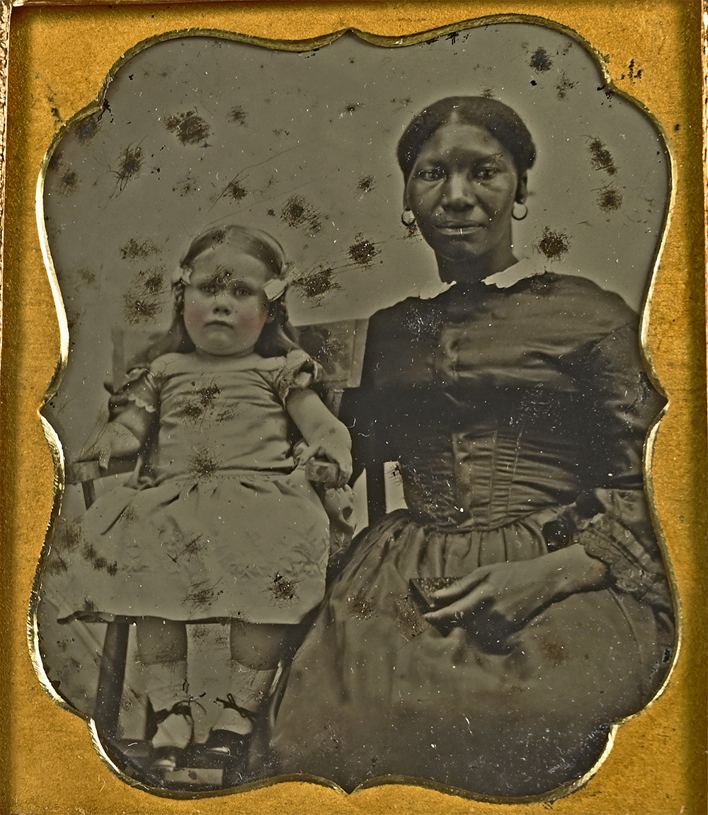 SPECTACULARLY CHARGED AMBROTYPE OF A BLACK NURSE AND WHITE CHILD