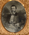 NINTH PLATE RUBY AMBROTYPE OF A MAN WITH A BELT KNIFE