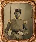 SIXTH PLATE AMBROTYPE OF A MILITIA OFFICER WITH SWORD AND PISTOL, LIKELY VIRGINIA