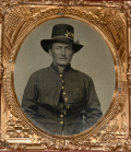 SIXTH-PLATE TINTYPE OF SOLDIER WEARING TWO INFANTRY INSIGNIA ON HIS HARDEE HAT
