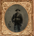 TINTED THREE-QUARTER STANDING VIEW OF AN ARMED UNION INFANTRYMAN