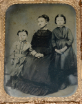 QUARTER-PLATE TINTYPE OF A GRIEVING MOTHER & HER CHILDREN IN A MOURNING THEMED UNION CASE 