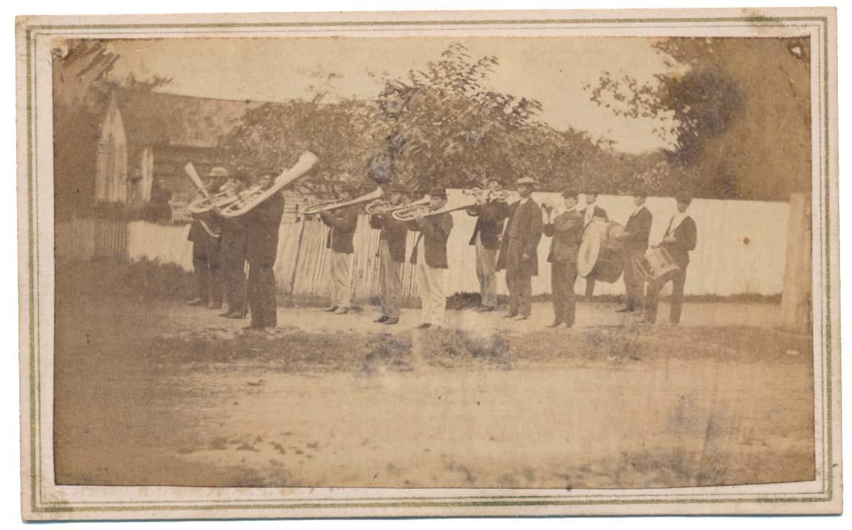 AN OUTDOOR VIEW OF A CIVIL WAR MARCHING BAND