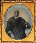 NINTH-PLATE AMBROTYPE OF AN ELDERLY WOMAN WITH BIBLE