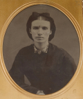 HALF PLATE TINTYPE OF A WOMAN IN A WONDERFUL UNION CASE TITLED “AMERICAN COUNTRY LIFE”