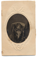 TINTYPE OF A DOG SITTING IN A CHAIR