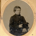 SIXTH PLATE TINTYPE OF BOY WITH DOG