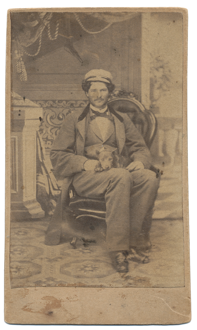 CDV SEATED VIEW OF A MAN AND HIS DOG