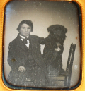 SIXTH PLATE DAGUERREOTYPE OF BOY WITH BLACK DOG