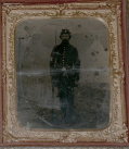 SIXTH PLATE TINTYPE OF A STANDING UNION INFANTRYMAN WITH AN OUTDOOR BACKDROP