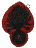 NICELY DONE 19TH CENTURY EMBROIDERED BURSTING BOMB INSIGNIA