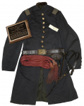 FROCK COAT, SASH, AND SWORD BELT OF CAPT. JOHN LONERGAN, 13th VERMONT: MEDAL OF HONOR FOR “DISTINGUISHED GALLANTRY IN ACTION AT GETTYSBURG, PA., JULY 2, 1863.” 