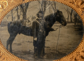 WONDERFUL OUTDOOR QUARTER-PLATE TINTYPE OF UNION OFFICER AND HIS MOUNT IN CAMP