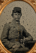 AMBROTYPE OF EARLY WAR CONFEDERATE OFFICER WITH SWORD