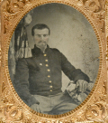 QUARTER-PLATE TINTYPE OF SEATED 6TH CORPS SOLDIER