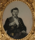 VERY NICE QUARTER PLATE AMBROTYPE OF FIRST LIEUTENANT WITH SWORD IN PATRIOTIC CASE