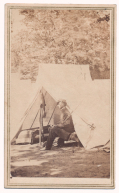 NICE OUTDOOR SCENE -- CDV OF SOLDIER SITTING IN TENT
