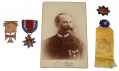 TIFFANY GOLD CUSTER MEDAL, SHERIDAN CAVALRY BADGE, NUMBERED MOLLUS MEDAL OF COL. GEORGE BRIGGS, 7TH MICHIGAN CAVALRY, WITH A PHOTO OF BRIGGS WEARING THEM, AND WITH HIS  7th MICHIGAN CAVALRY VETERAN’S RIBBON