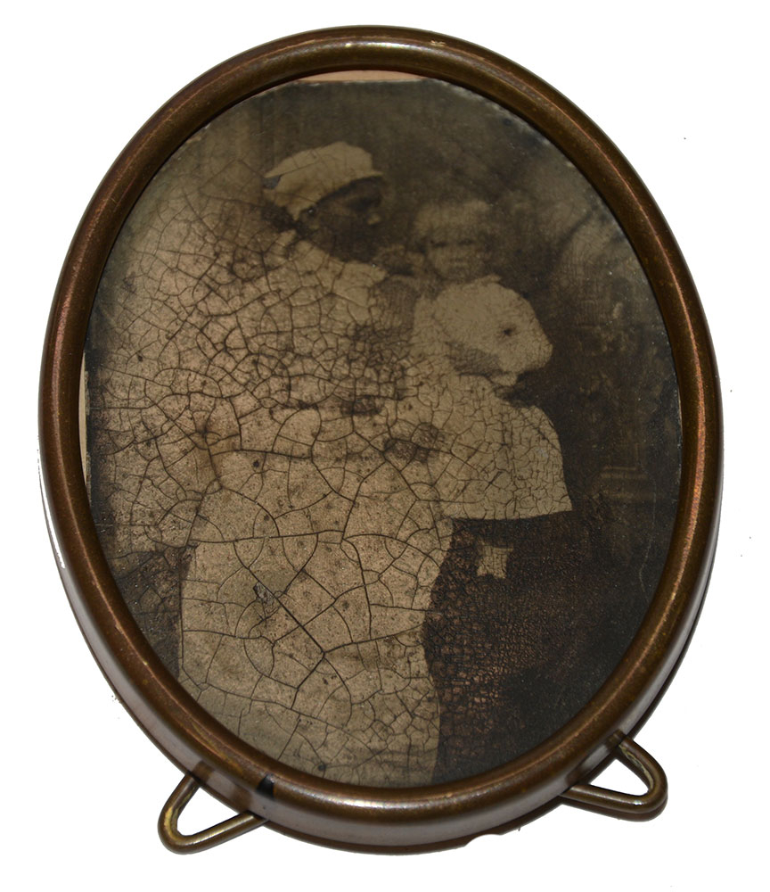 OVAL TINTYPE OF BLACK NANNY WITH WHITE CHILD