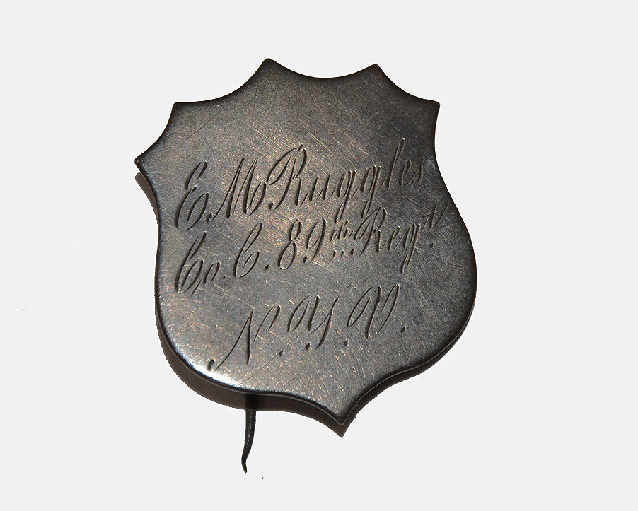 SILVER SHIELD-SHAPED ID BADGE – 89TH NEW YORK; ELI M. RUGGLES