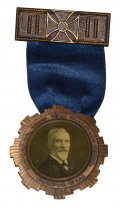 MONROE COUNTY VETS ASSOCIATION RIBBON BADGE – CAPT. HENRY LOMB, 1915 (13th NY), FOUNDING PARTNER OF BAUSCH AND LOMB