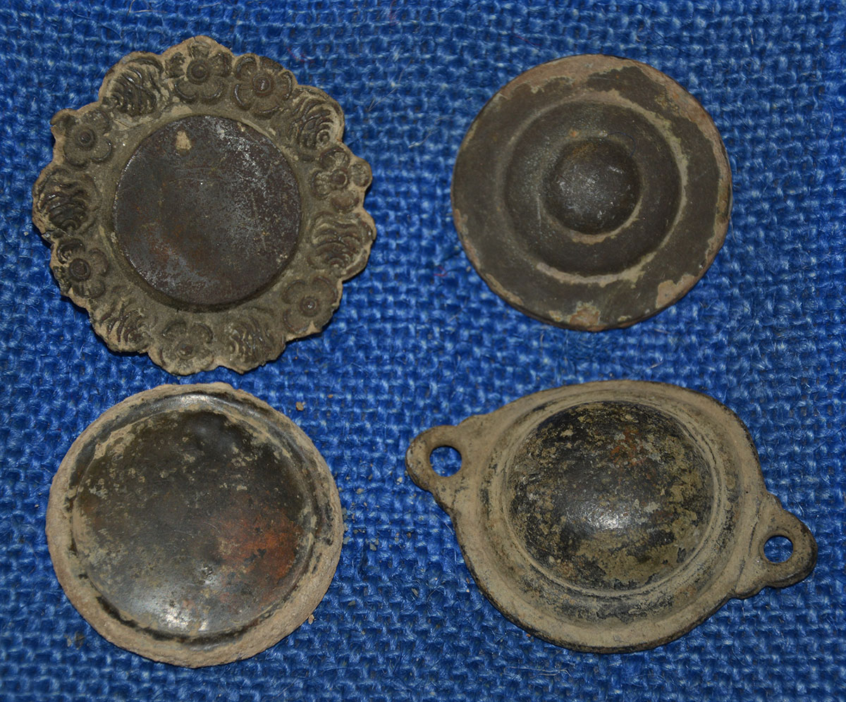 SET OF FOUR DUG BRIDLE ROSETTES