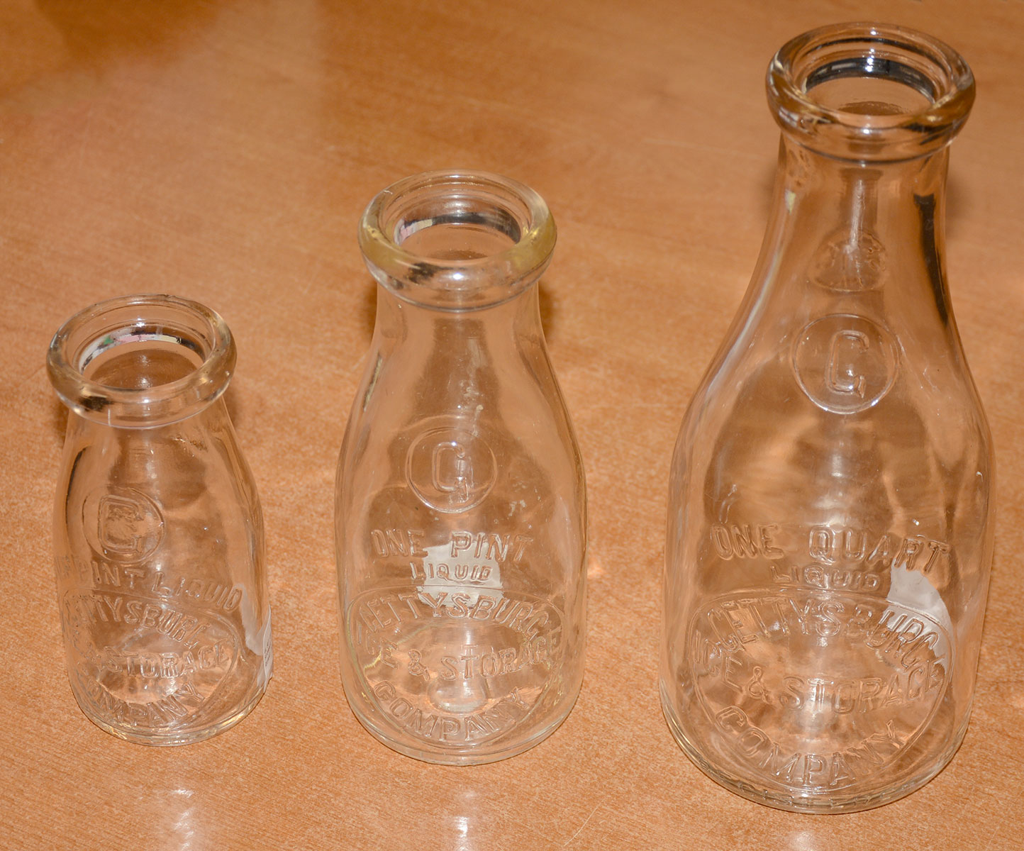 SET OF THREE VINTAGE GETTYSBURG ICE & STORAGE CO. MILK BOTTLES