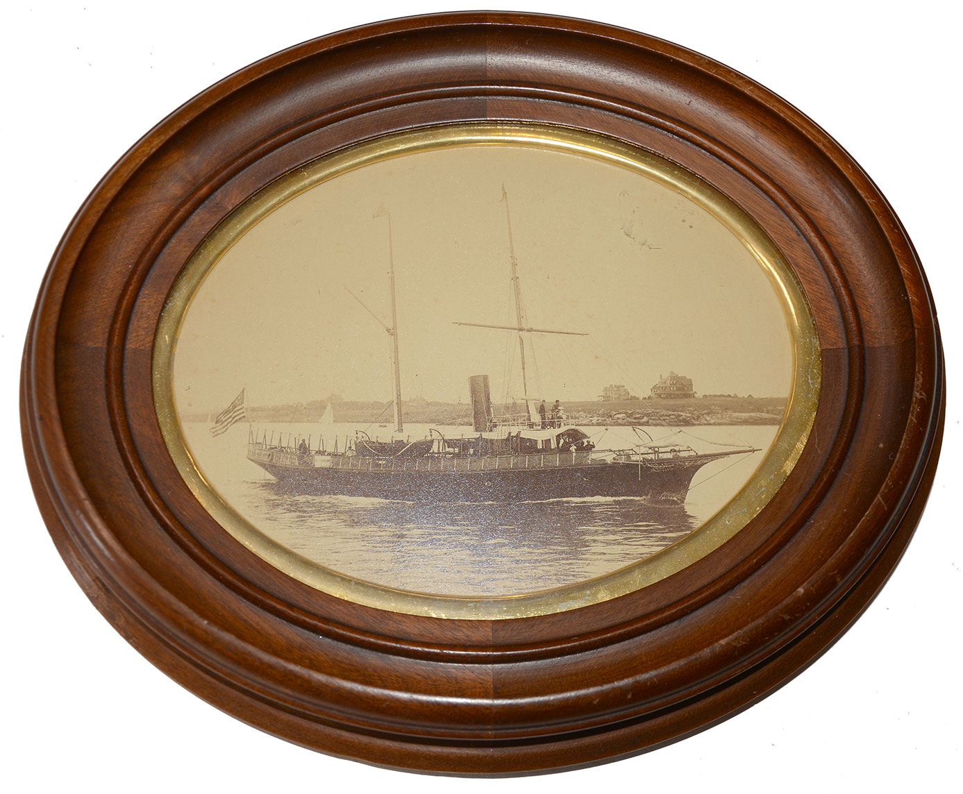 NATHANIEL STEBBINS OVAL FRAMED PHOTOGRAPH OF THE ADMIRAL STEAMING OUT EAST PASSAGE, NEWPORT, R.I. 