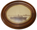 NATHANIEL STEBBINS OVAL FRAMED PHOTOGRAPH OF THE ADMIRAL STEAMING OUT EAST PASSAGE, NEWPORT, R.I. 
