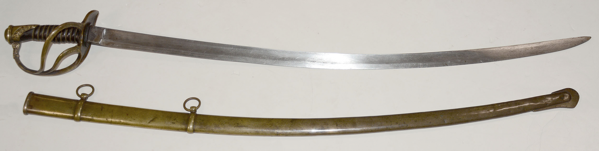 CONFEDERATE OFFICER’S CAVALRY SABER WITH BRASS SCABBARD, MADE BY THOMAS GRISWOLD & CO., NEW ORLEANS
