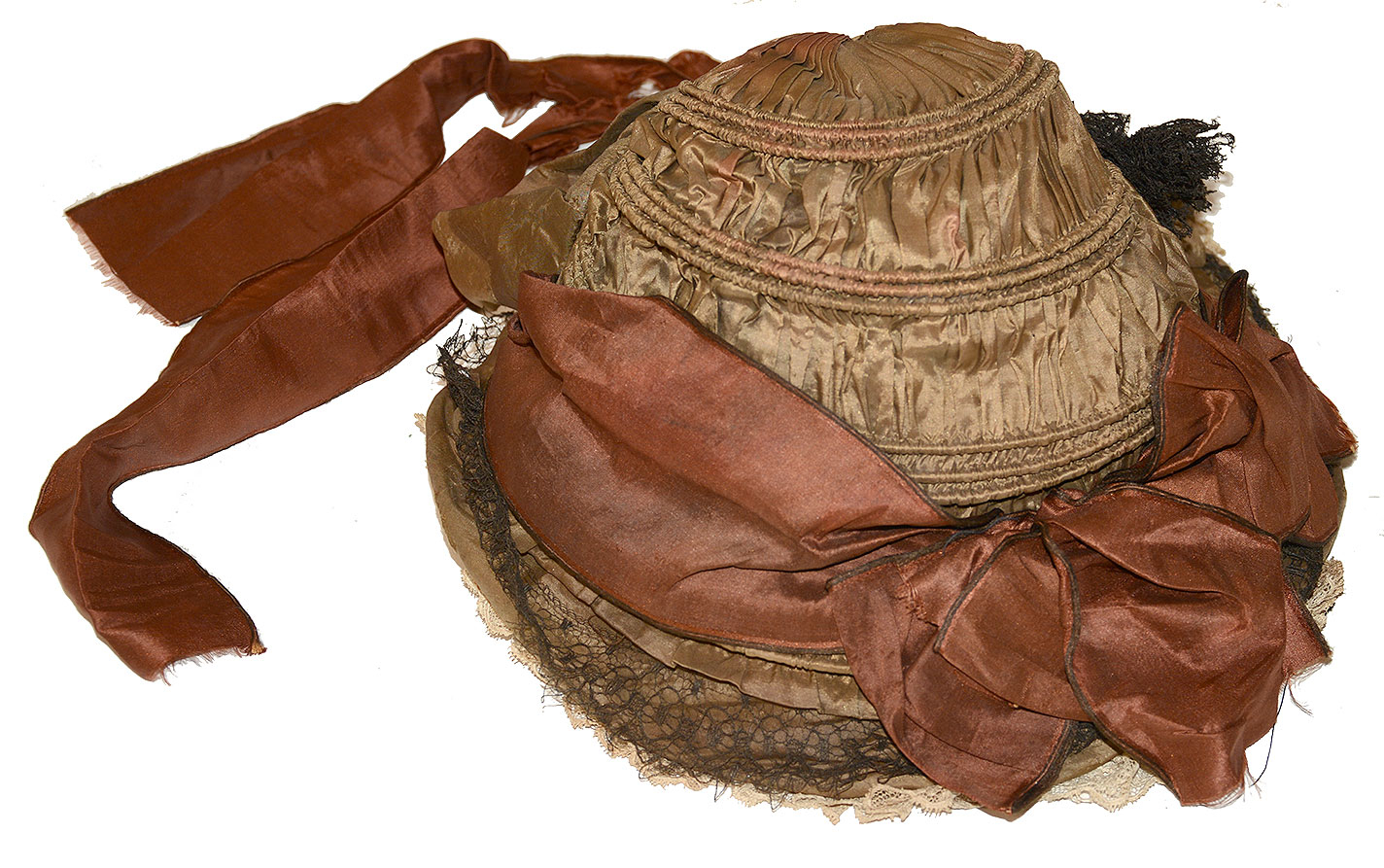 FASHIONABLE DRAWN SILK BONNET, C. 1855-1865