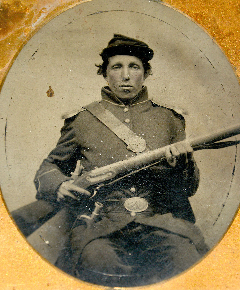 EXCELLENT AMBRO OF US ENLISTED MAN WITH MUSKET AND DRESS TRIMMINGS