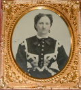 CASED TINTYPE OF WOMAN IN FANCY DRESS AND TINY WAIST